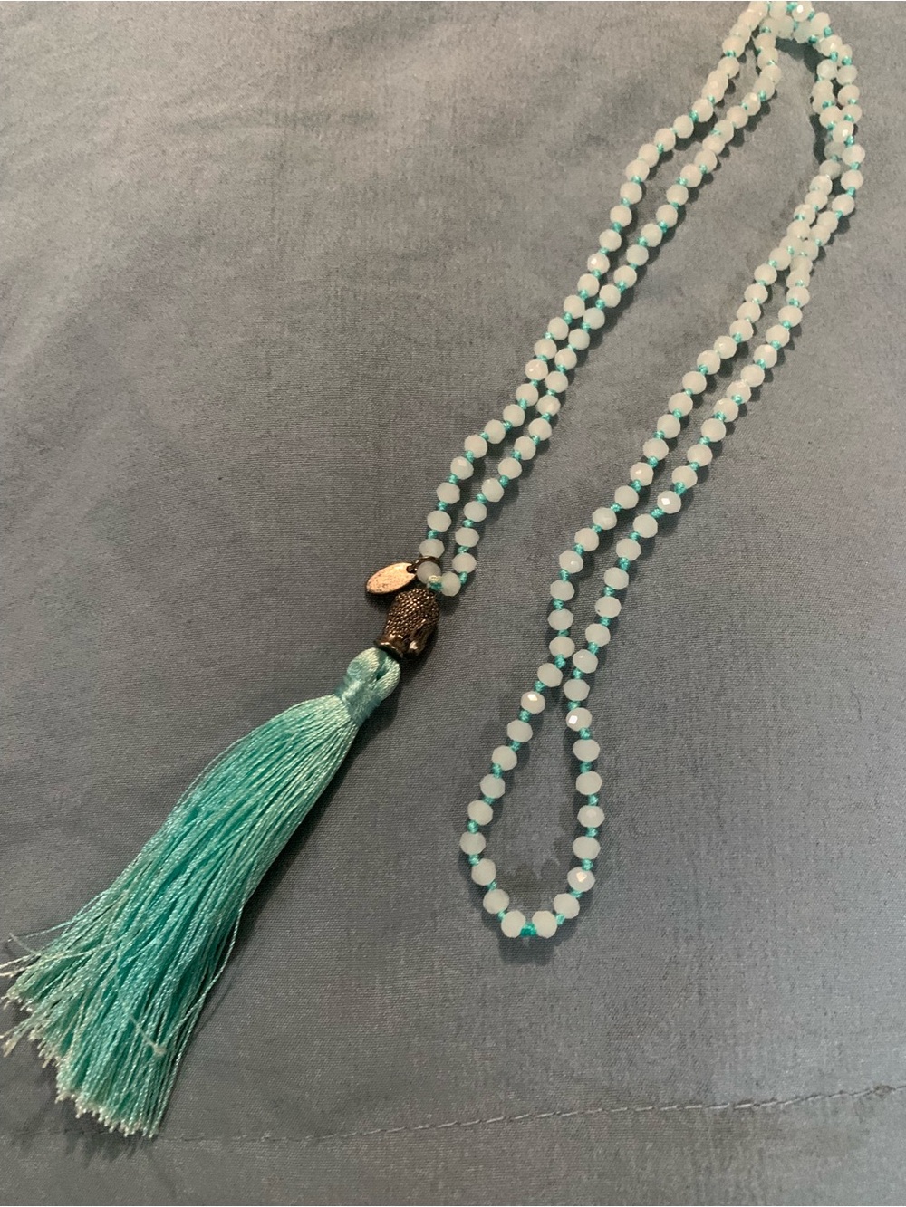 Handmade Light Teal Beaded Mala Necklace with Tassel and Buddha Charm by Kelitch